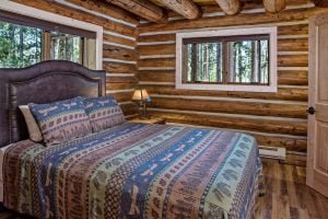 Cabin 29 bed at Redfish Lake Lodge